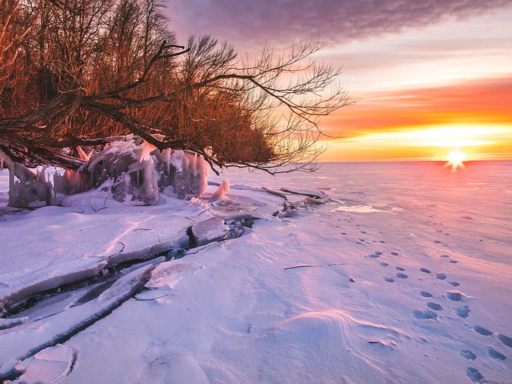 Sunset on the frozen Lake Winnebago, one the top ice fishing spots in Wisconsin