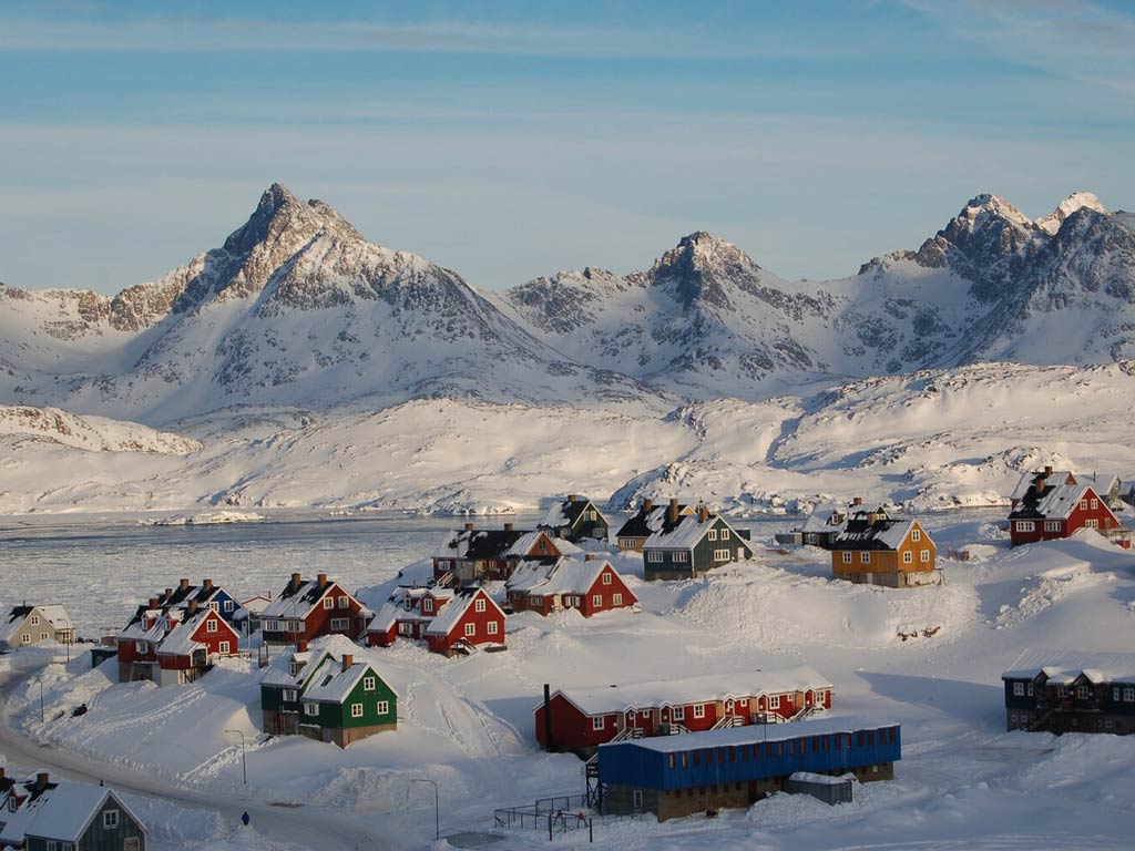 A magnificent view of colorful houses in Tasiilaq and its nearby frozen lake of Greenland