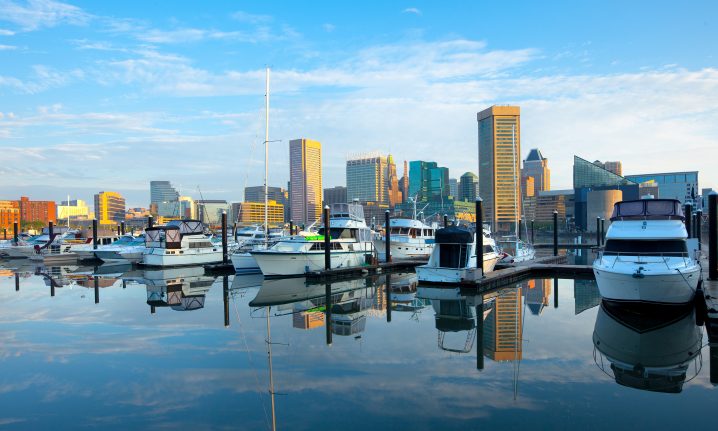 Baltimore Marina with boats in the center and tower blocks in the distance