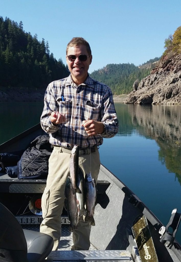 Paul Hale with three rainbow trout on Lost Creek Lake