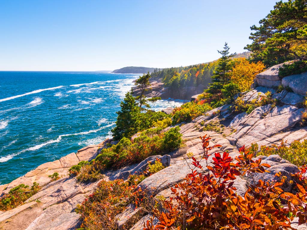 A photo featuring Acadia National Park and a view from a cliff looking at the water below