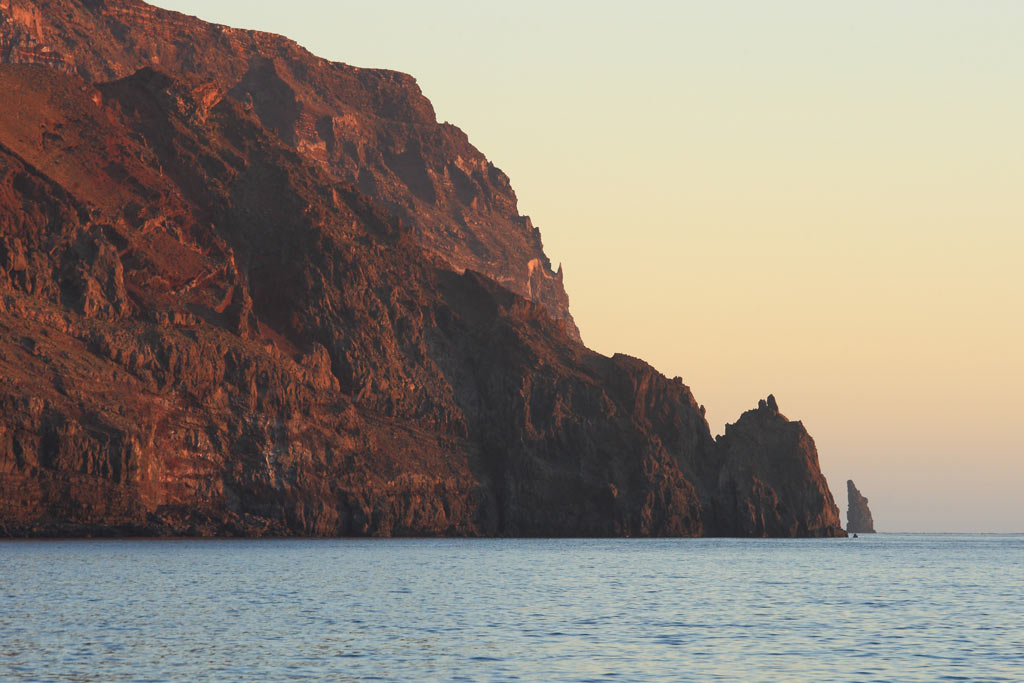 A photo of the rocky cliffs of Guadalupe Island in Mexico, one of the premier long range fishing destinations out of San Diego.