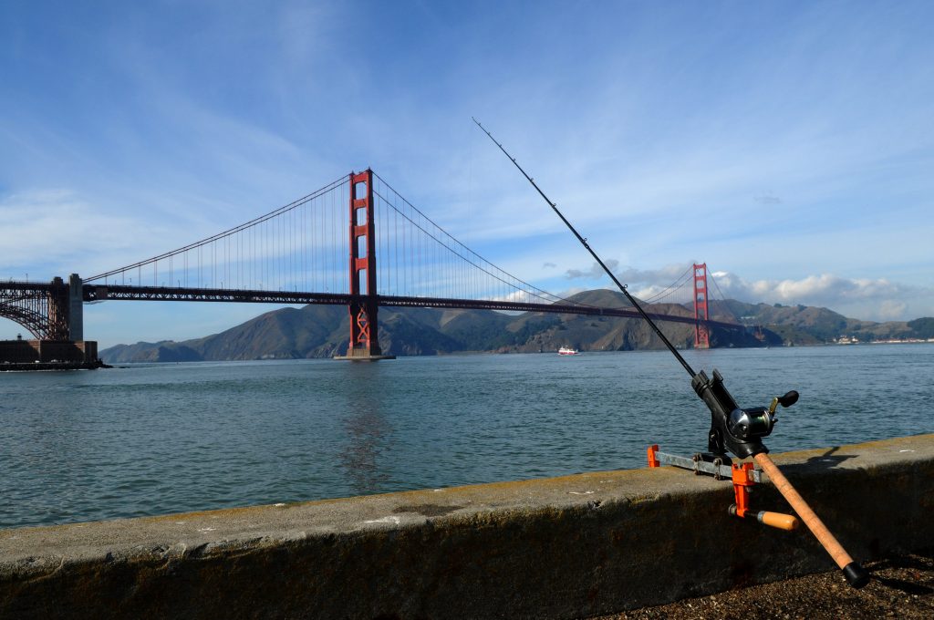 A fishing rod with a view of the San Francisco Bay and the Golden Gate Bridge