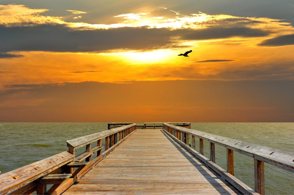 A sunset view from an empty fishing pier in Chesapeake Bay, Maryland