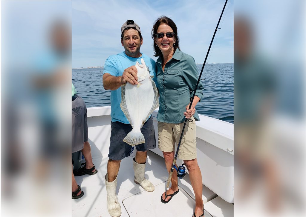 Captain and client with a fluke