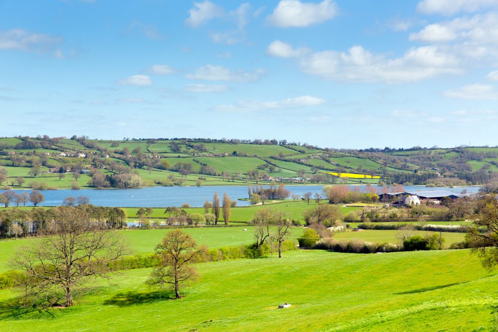 Green fields and a blue lake in Somerset