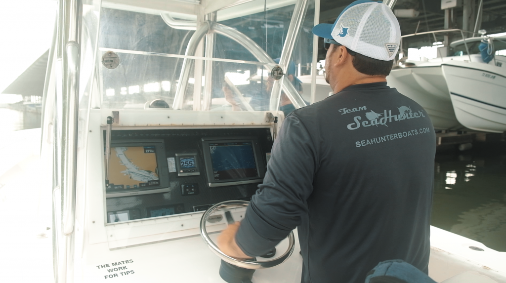 Captain driving boat into the dock