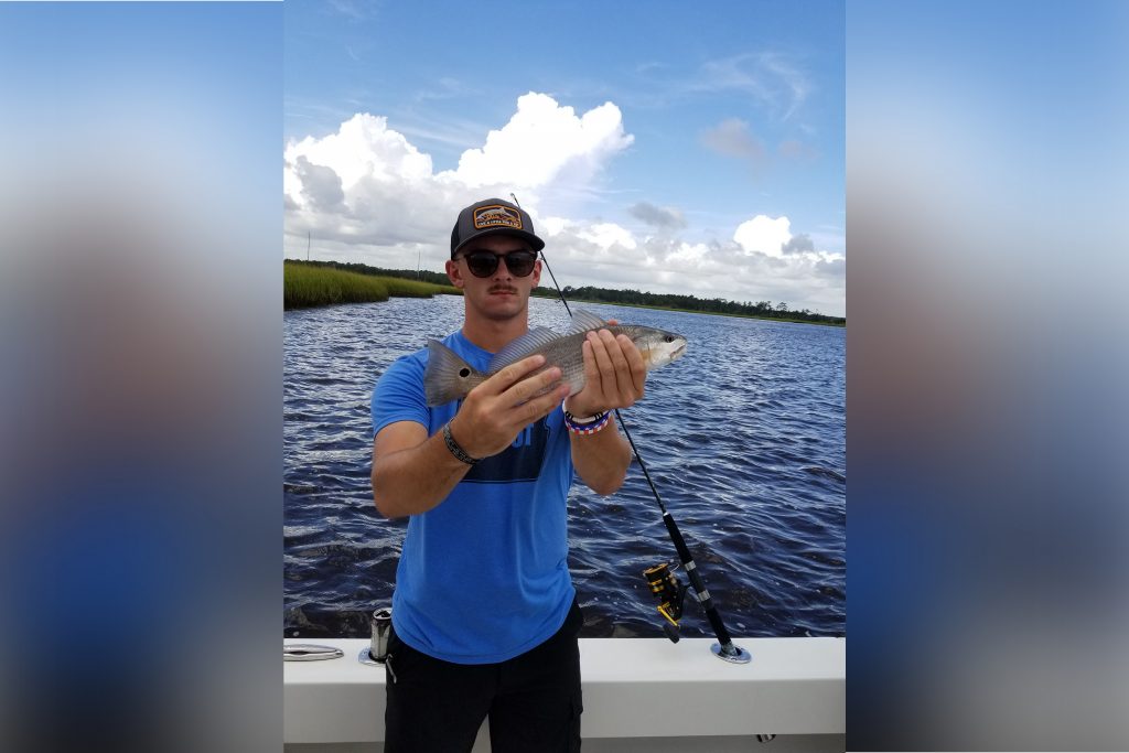 Man holding a redfish