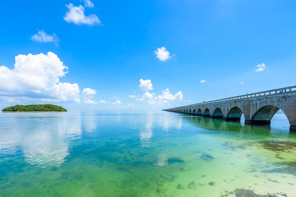 Long Key Bridge in Florida, with clear waters all around and blue skies