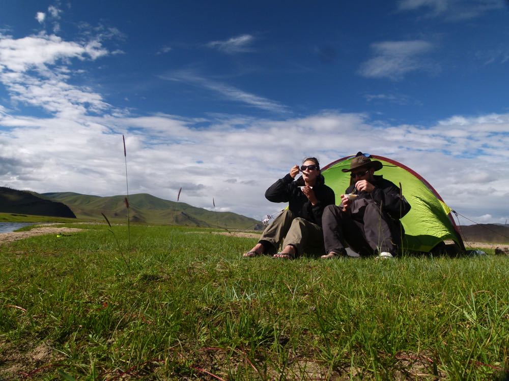 Tent and two people in Mongolian landscape
