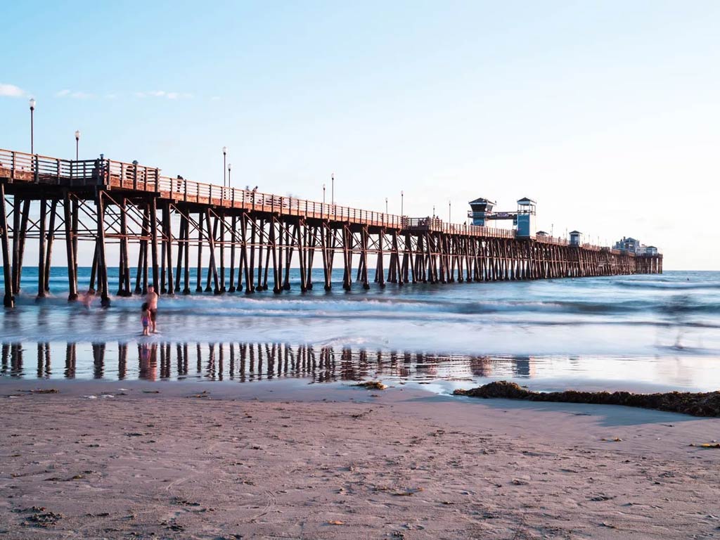 A view of the iconic Oceanside Pier from the beach
