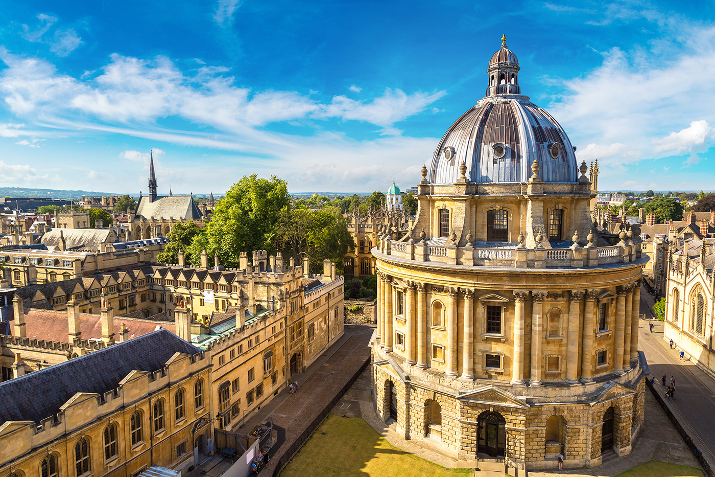 An aerial view of Oxford, with the Radcliffe Camera and University Buildings visible in the distance
