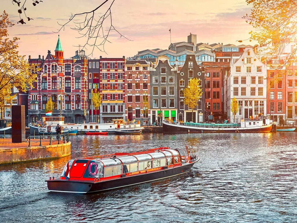 A view of the canals in Amsterdam during the golden hour in fall