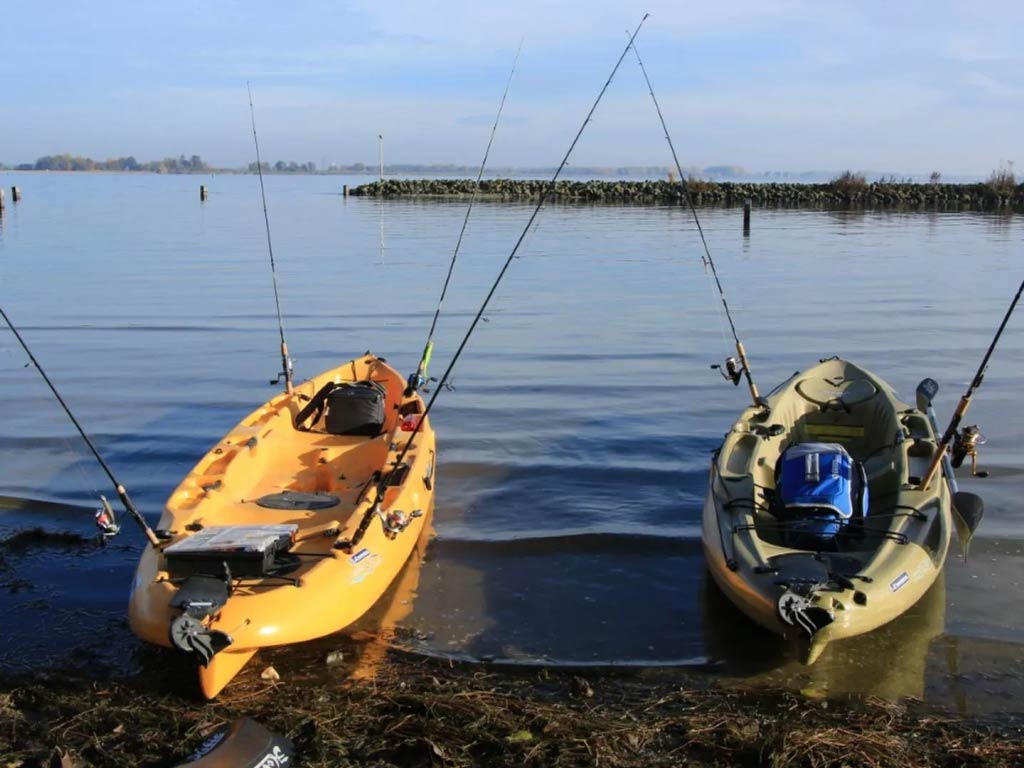 A photo featuring two fishing kayaks on the waters of the Netherlands