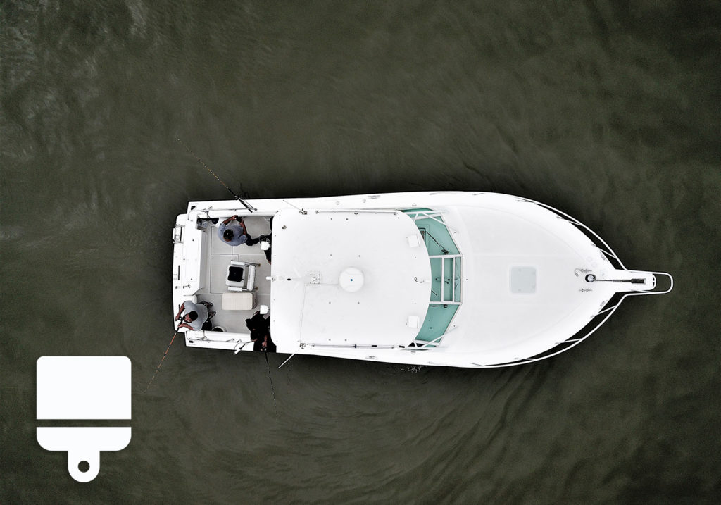 A bird's view of a boat with an icon of a painting brush in the bottom left corner