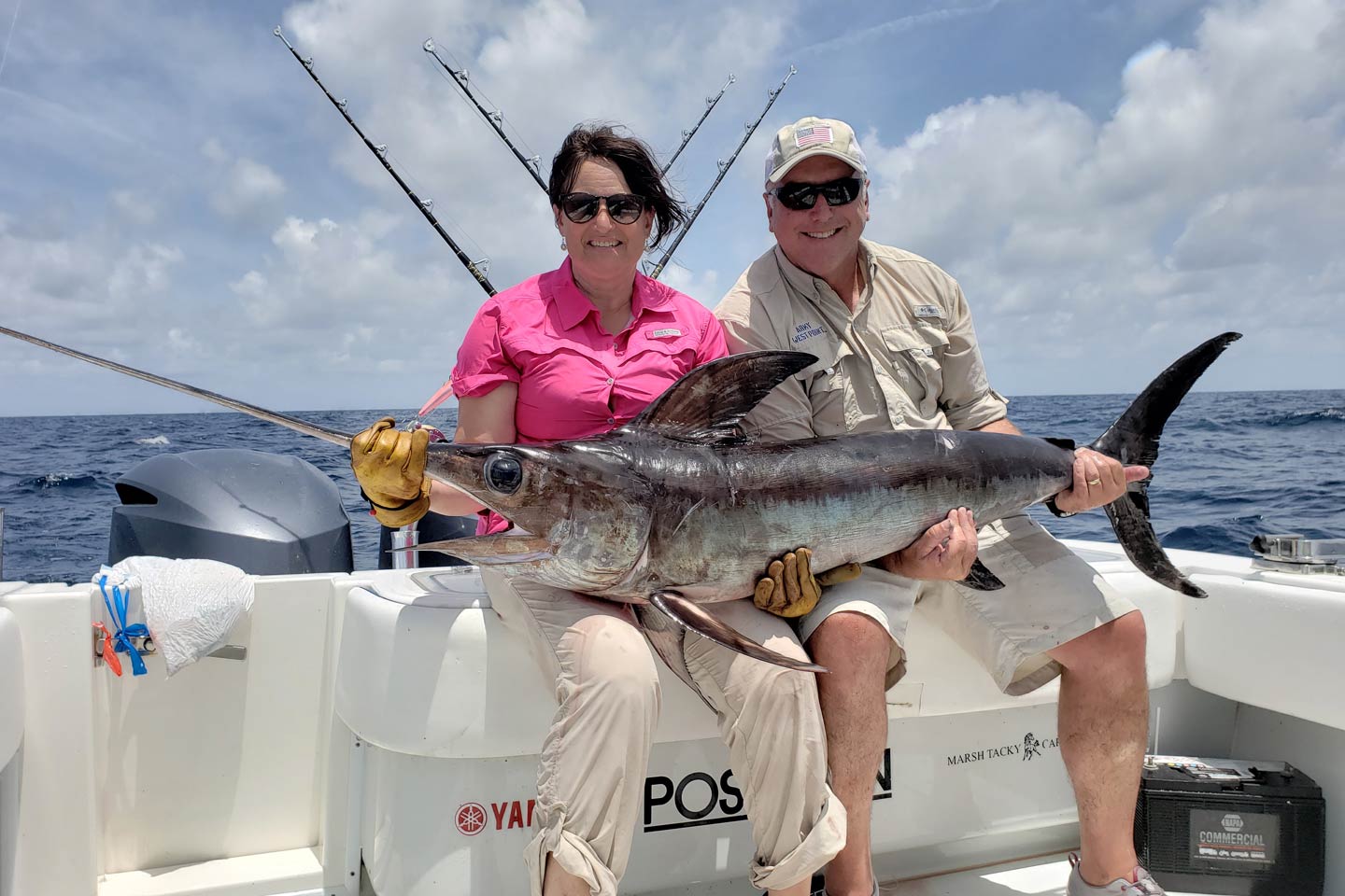 A male and female angler showing off a Swordfish caught in Venice's offshore waters.