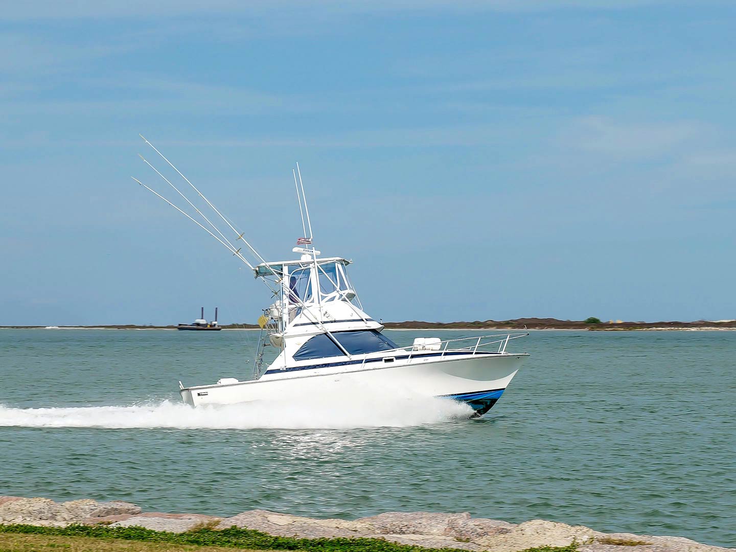 Beautiful white fishing yacht boat sails on calm water