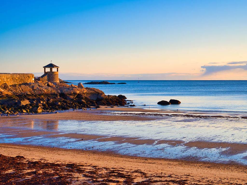 A sunset photo of a beach somewhere in Massachusetts