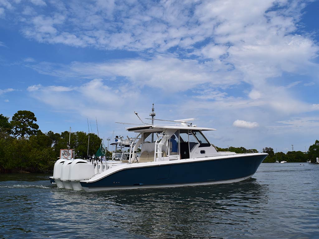 A center console fishing boat floating on the water somewhere near Tarpon Springs, Florida