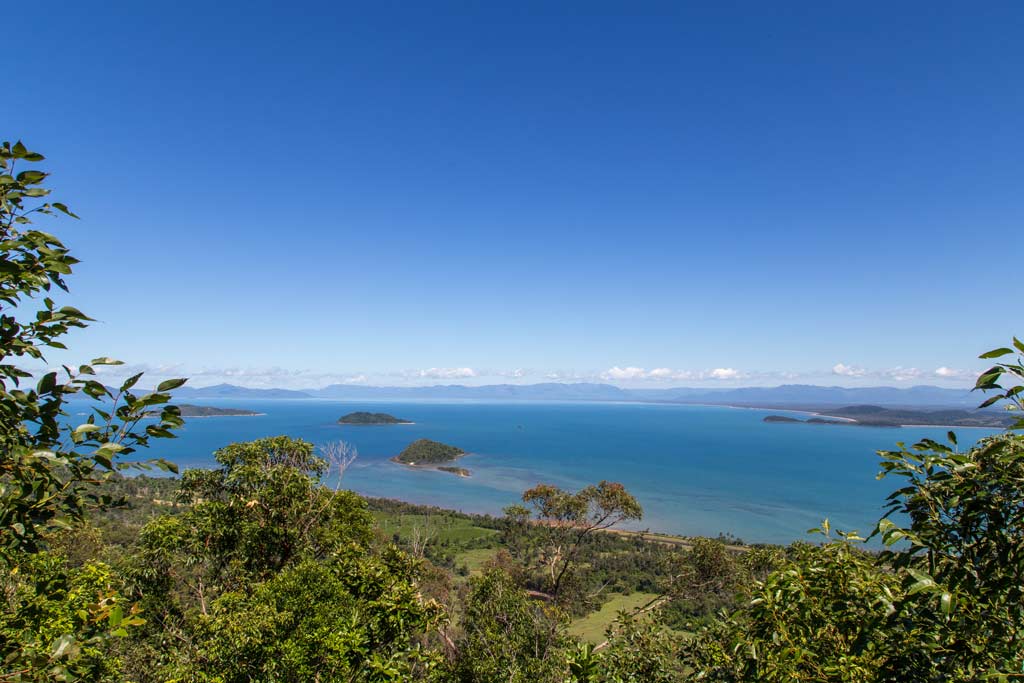 An aerial view of the waters and wooded area around Kurrimine Beach