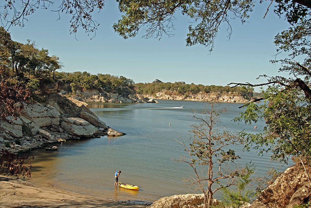 A kayaker pushes his boat into Lake Texoma