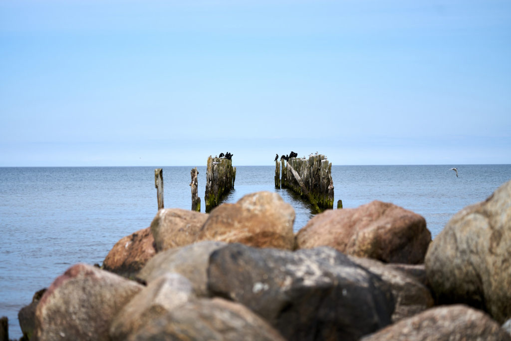 Old abandoned L-shaped stone fishing pier Bocahenge in Boca Grande on Gasparilla Island, Florida
