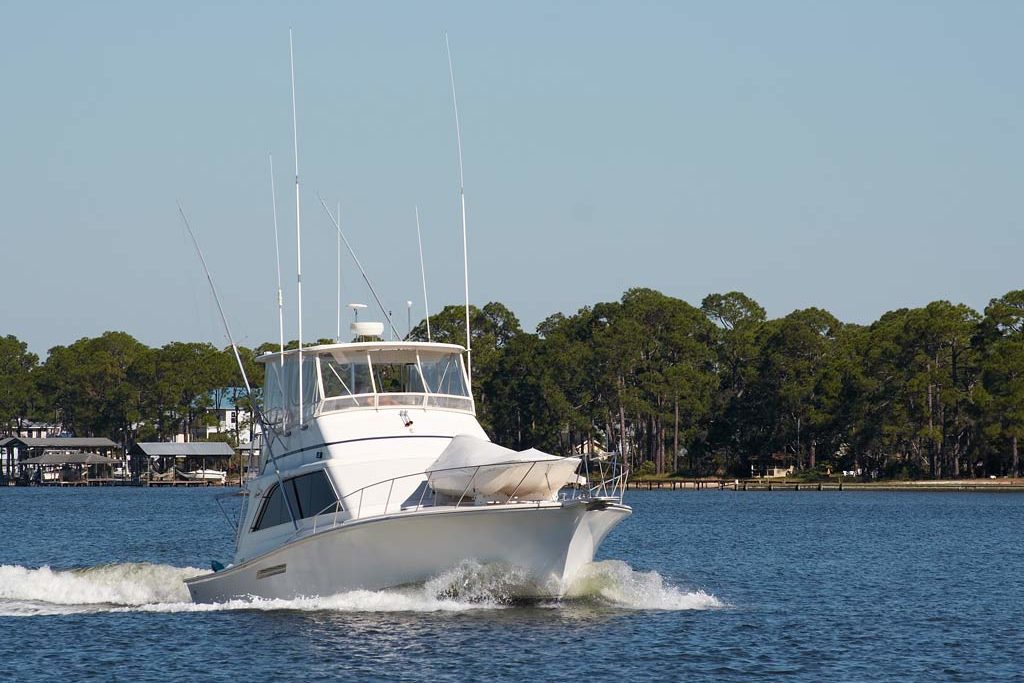 An offshore fishing boat riding through the water