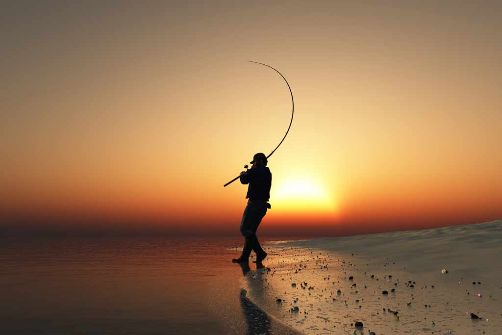 A father with a fishing rod on his shoulder standing on the edge of the  shore