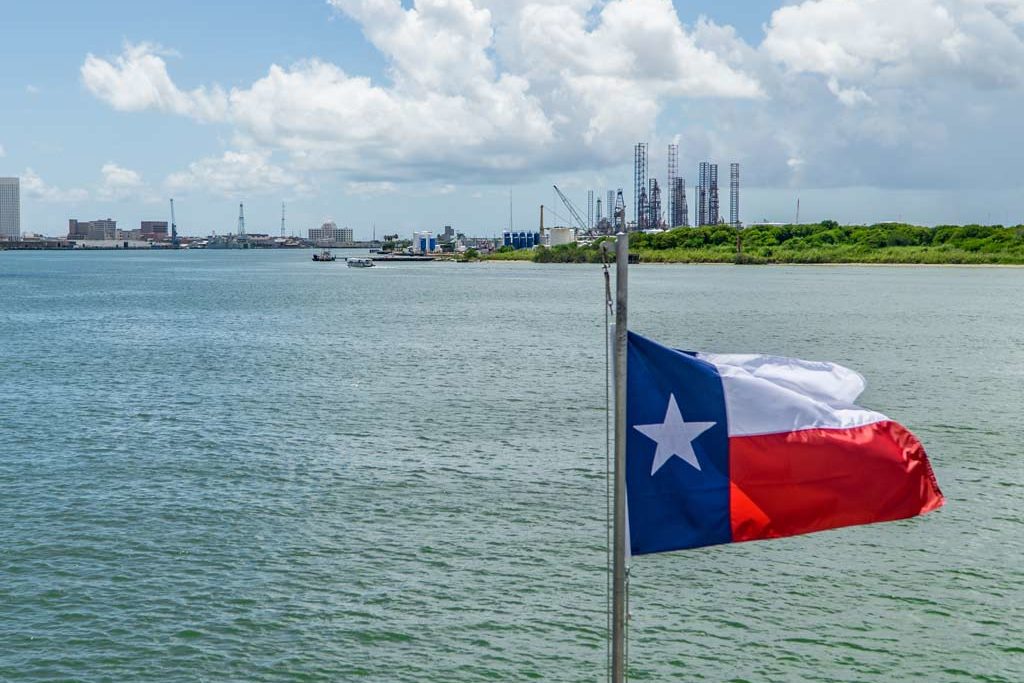 The flag of Texas flying over Galveston Bay.