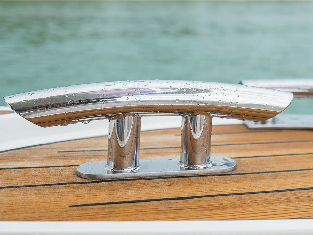 A closeup shot of a cleat on a yacht.