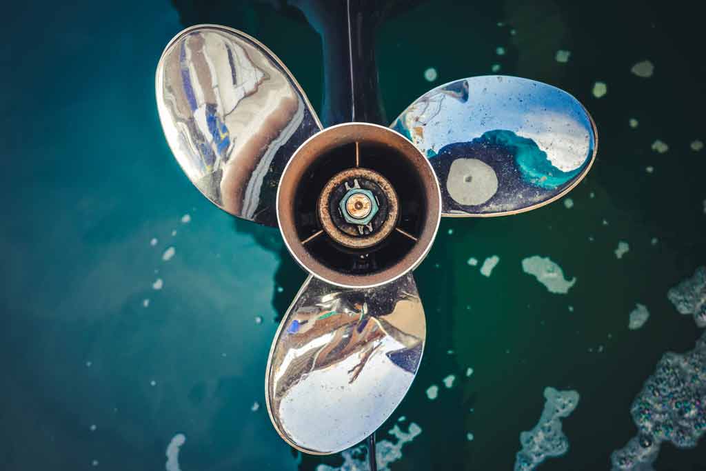 A close-up of a clean propeller out of the water