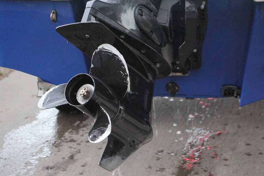 A close-up of a lower gearcase on a boat engine