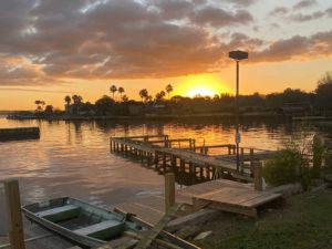 A shoreline view of Lake Conroe at sunset.