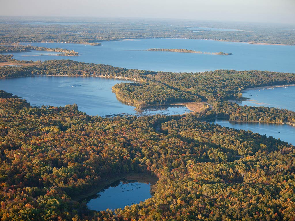 An aerial view of the Brainerd Lakes Area dotted with the great fisheries and surrounded by thick greenery