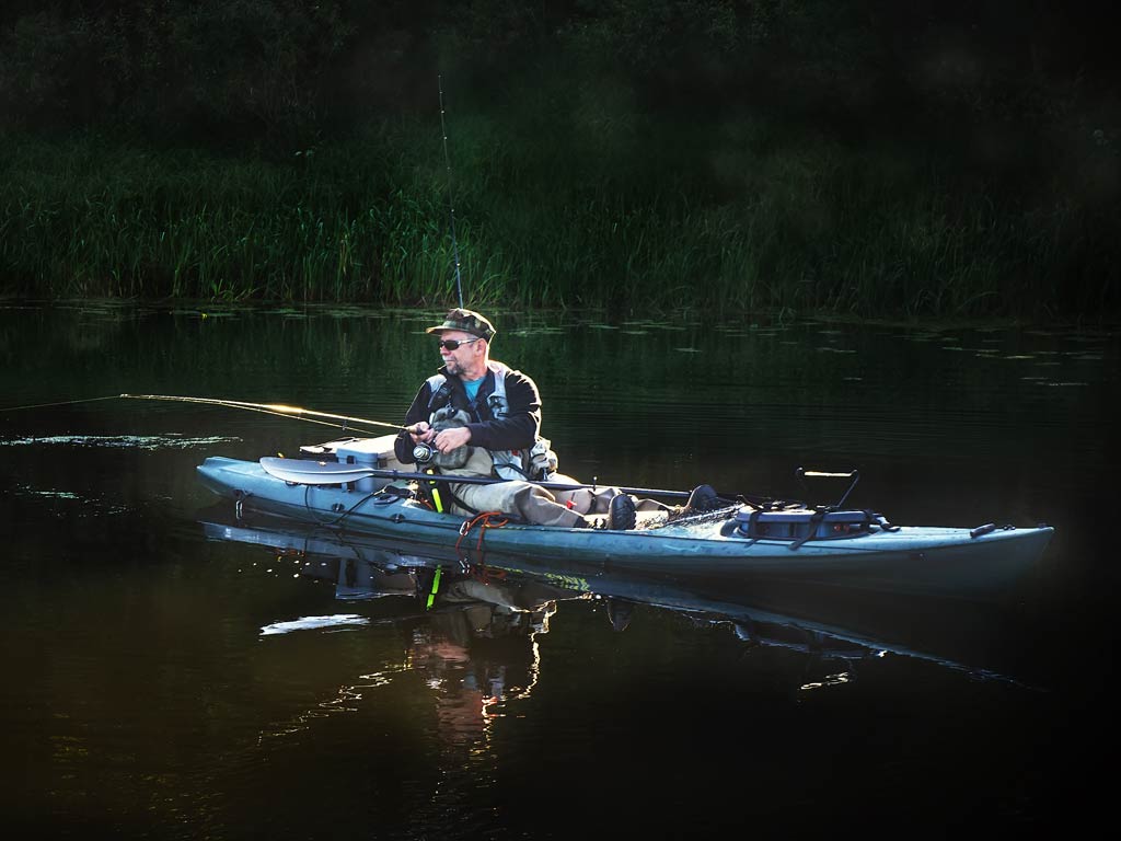 A photo of a kayak angler fishing on the lake
