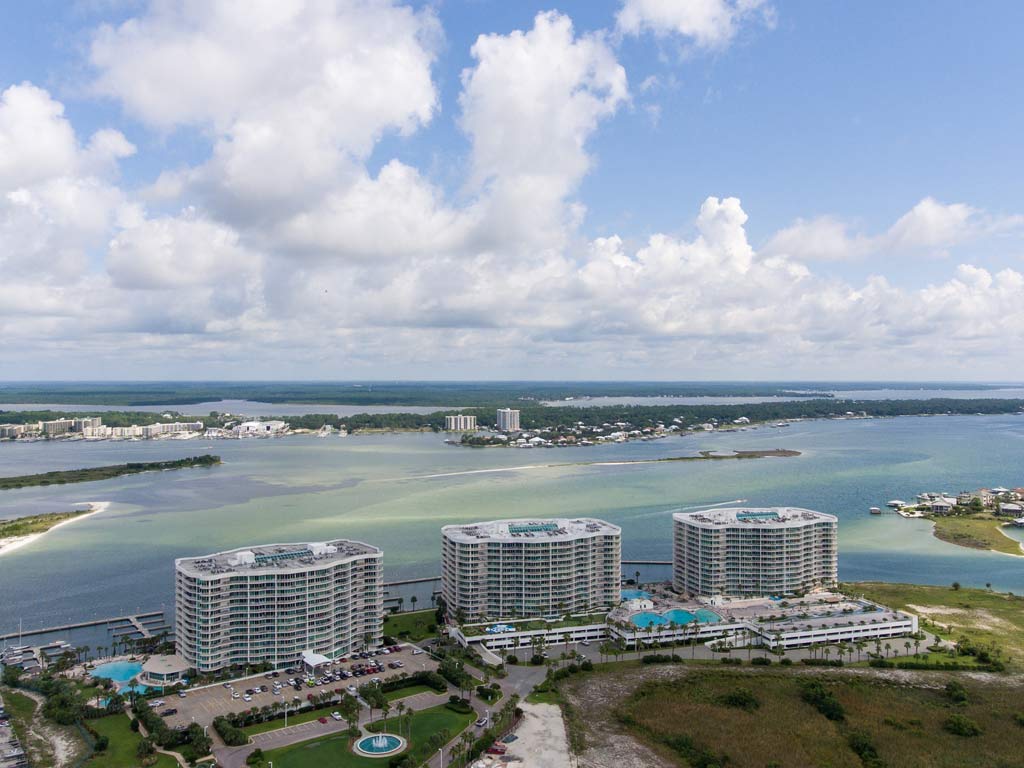 An aerial photo of Orange Beach and Perdido Pass on a day with sunny intervals.