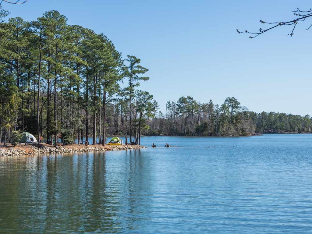 A photo of the beautiful Lake Murray and the foliage surrounding the lake on a sunny day.