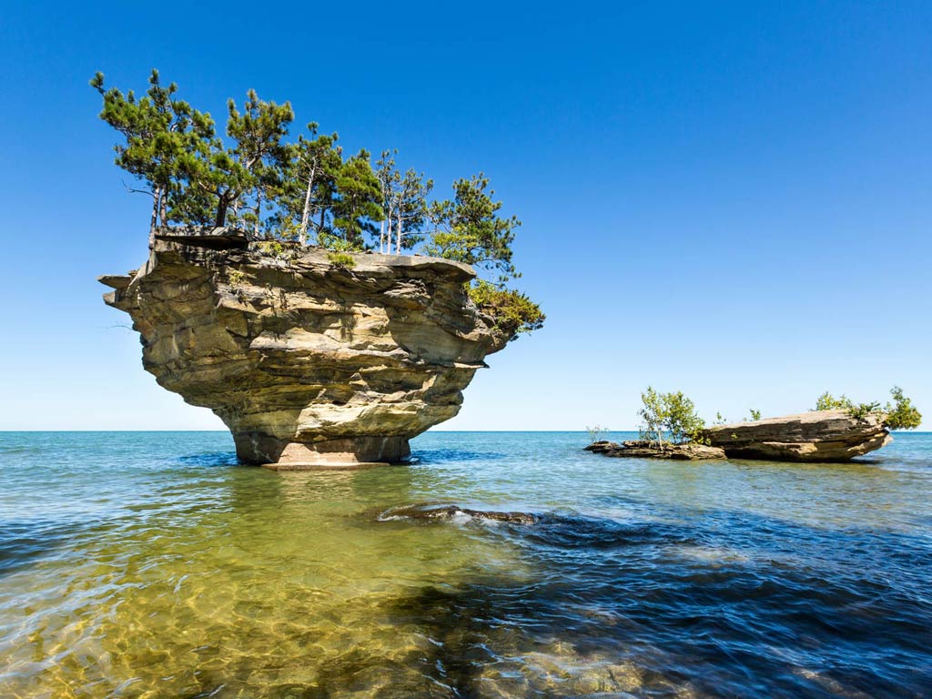 A photo of Turnip Rock on Lake Huron in Michigan taken on a bright and sunny day in simmer