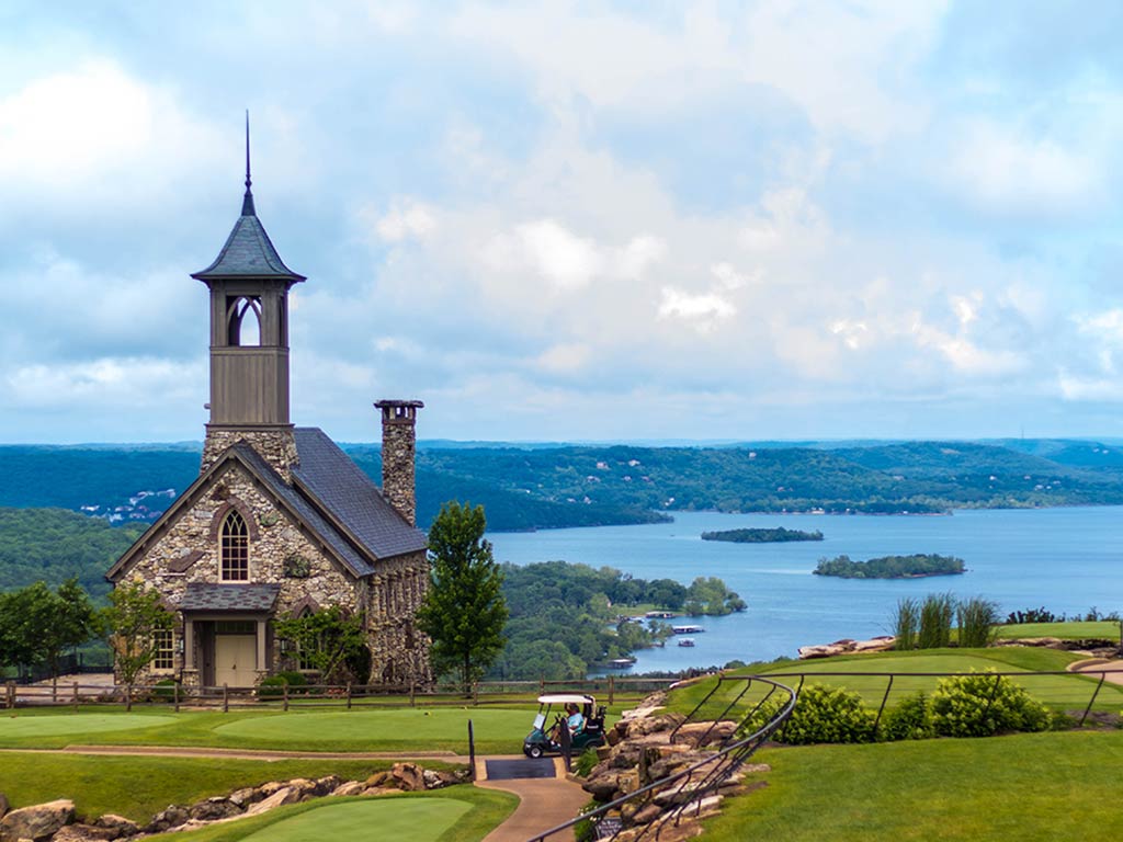 A view from a hill in Branson, MO, towards Table Rock Lake, with a church visible on the left of the image