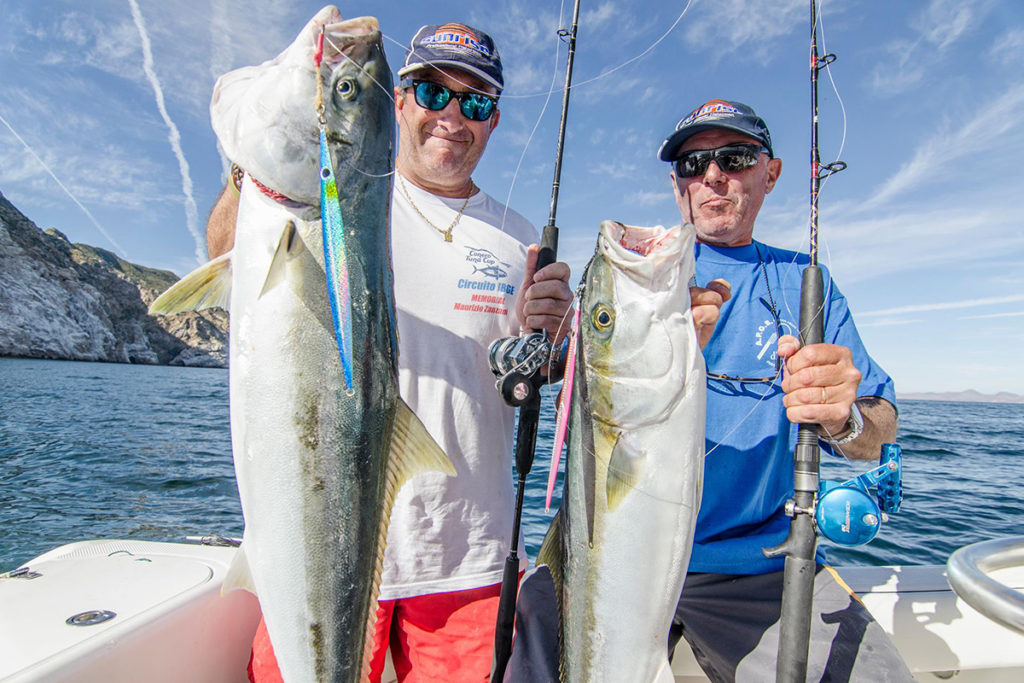 Two anglers holding large Yellowtail Amberjacks caught off the coast of Catalina Island.