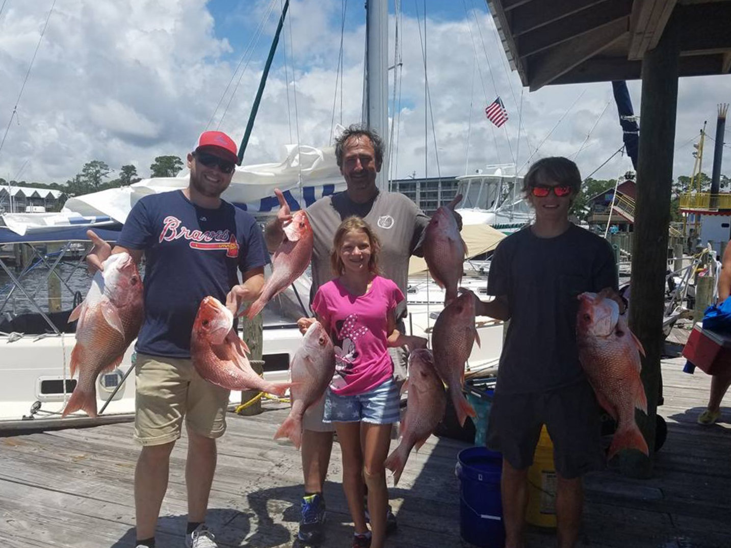 Fishing Through Covid-19: Captain Thomas Richardson from Orange Beach and customers posing with Red Snapper they caught in the summer of 2020
