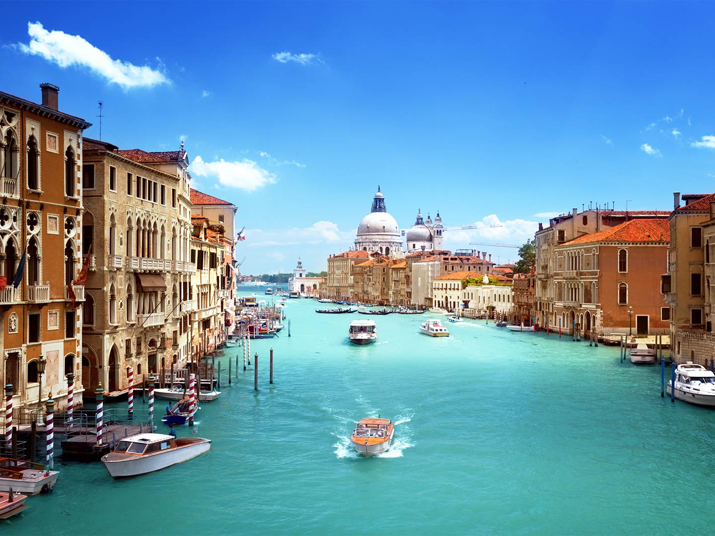 A view of a canal stretching to a church in Venice, Italy