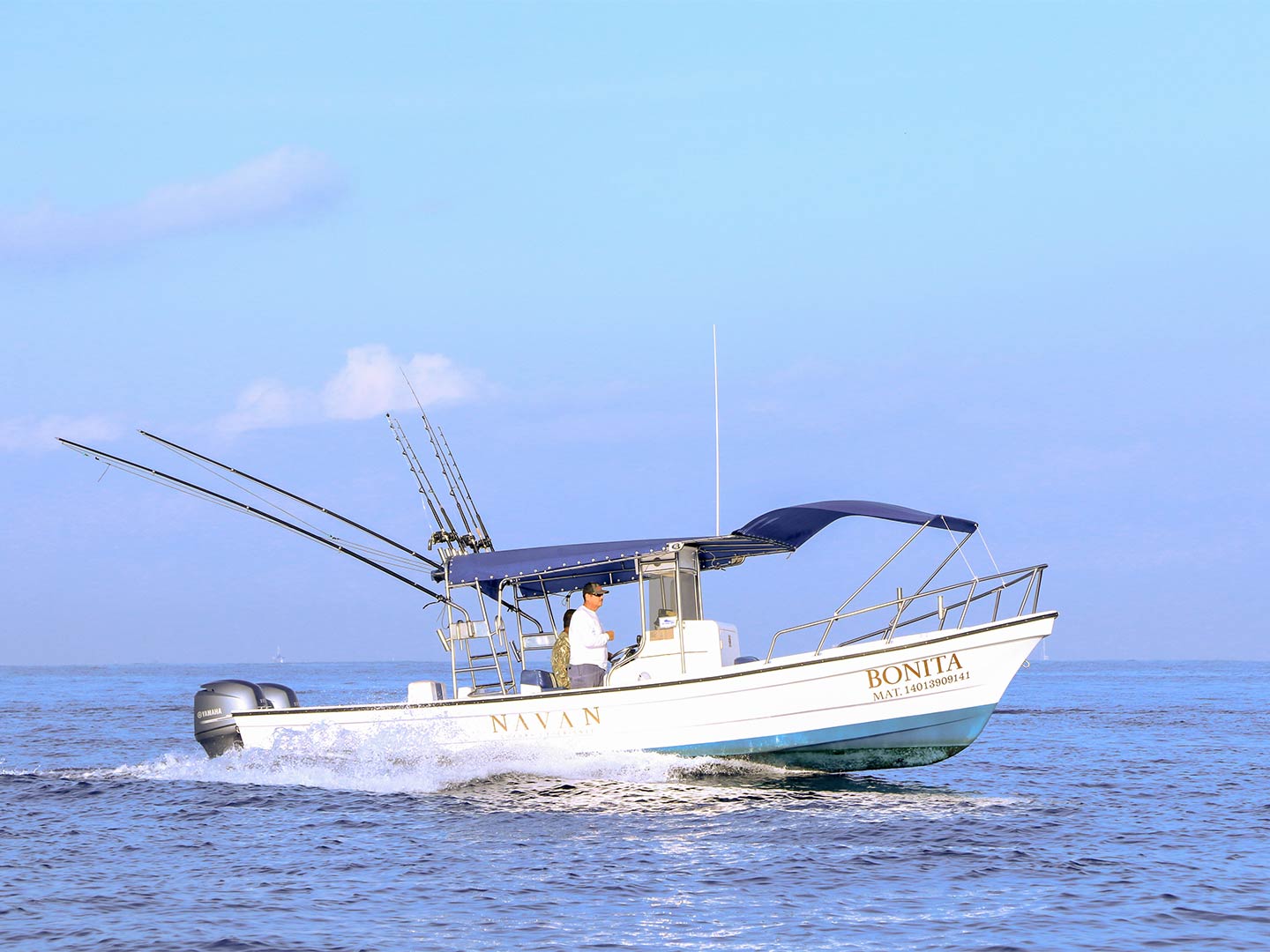 A captain navigates a panga fishing boat in Puerto Vallarta