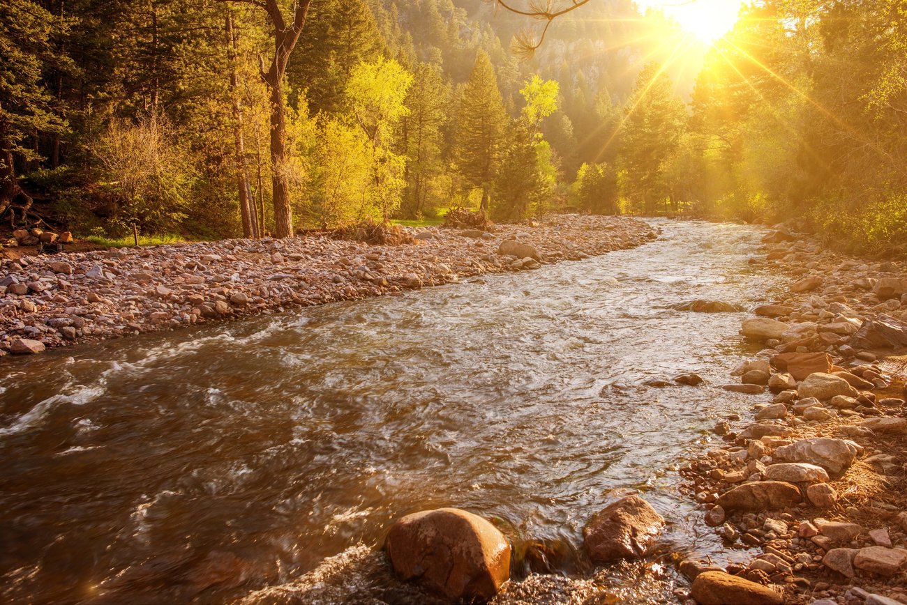 Sunset over the river creek in Colorado