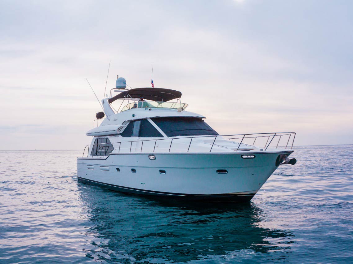 A large yacht sails along the calm waters of the Sea of Cortez.