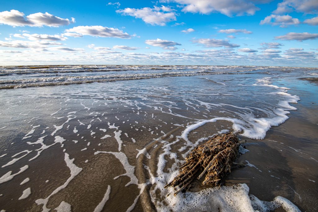 a view of the Gulf of Mexico from the beach in Freeport, Texas