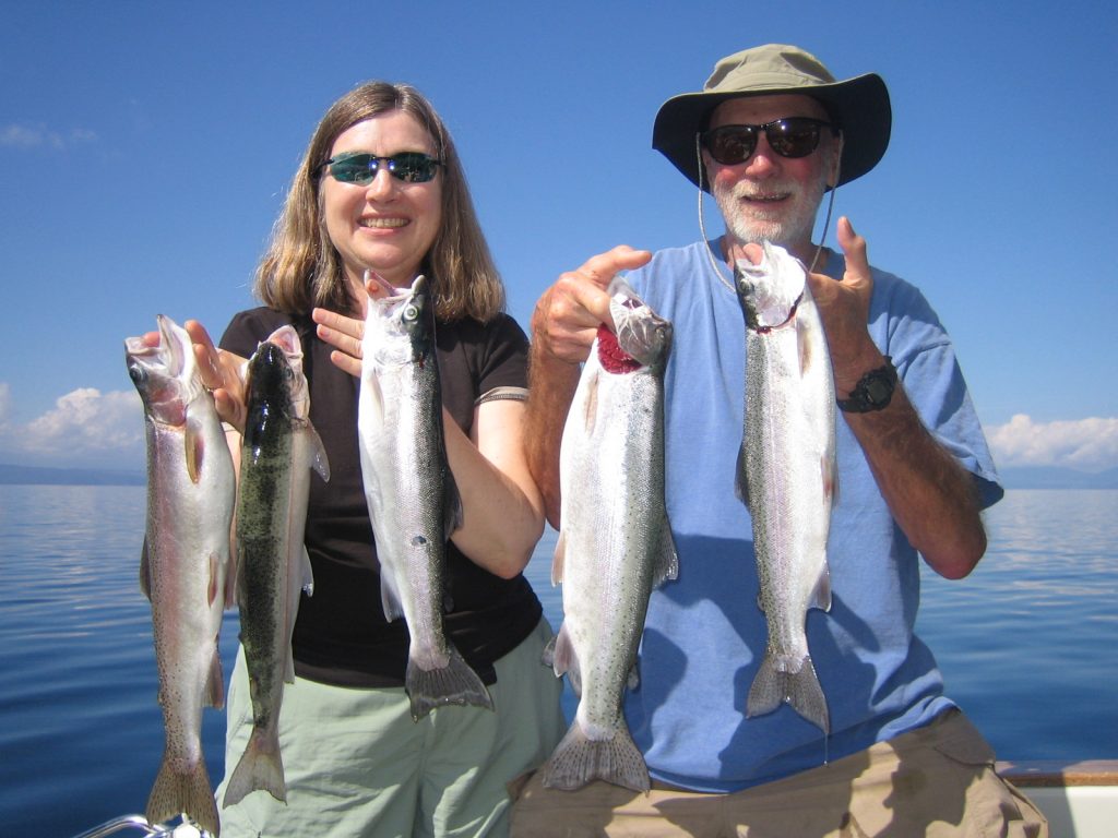 anglers holding Trout on Lake Taupo