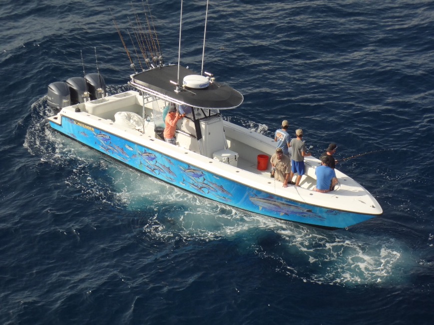 An aerial view of a center console fishing boat full of angler in Galveston, Texas