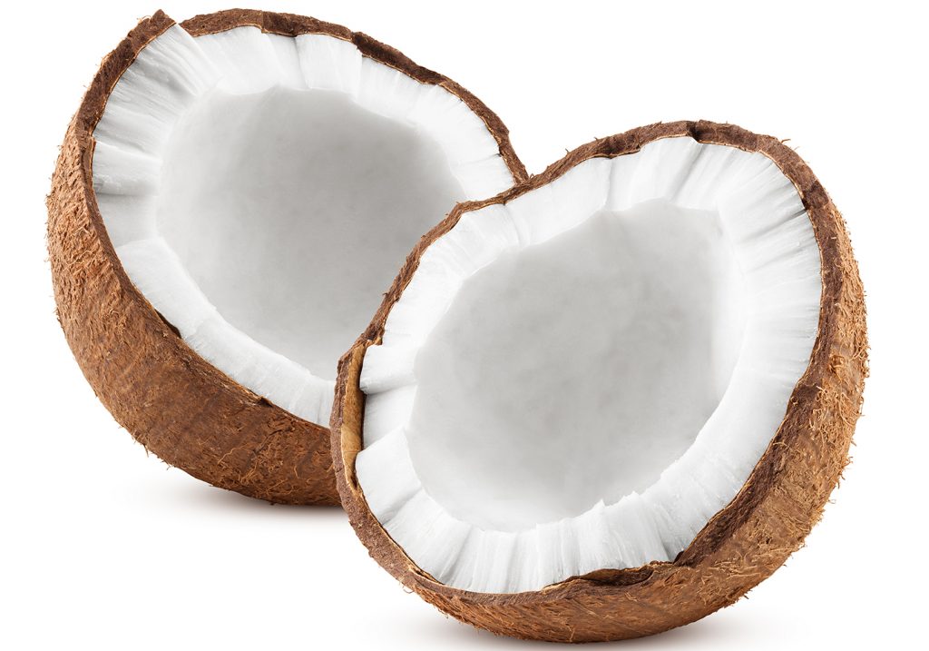 Two halves of a coconut on a white background