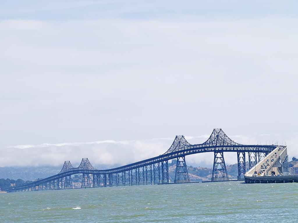 A view across the water on a hazy day towards the San Rafael bridge near Richmond, CA